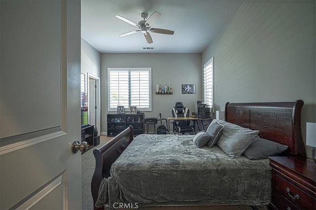 13471 Planet Ct, Riverside, CA 92503 - carpeted bedroom with a desk and a ceiling fan