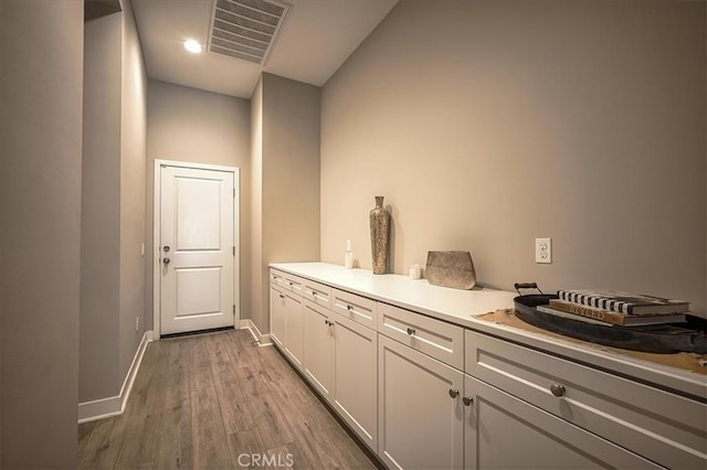 13471 Planet Ct, Riverside, CA 92503 - bar area with baseboards and wood finished floors