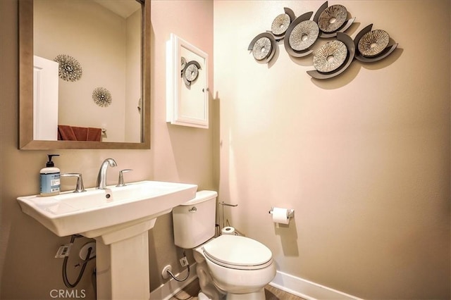 13471 Planet Ct, Riverside, CA 92503 - bathroom featuring toilet and baseboards