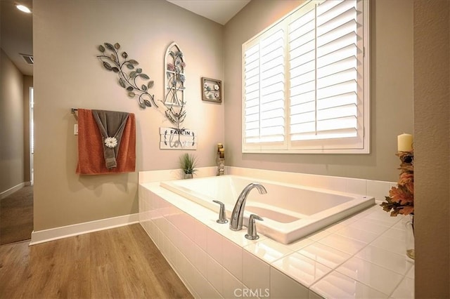 13471 Planet Ct, Riverside, CA 92503 - bathroom featuring a bath and wood finished floors