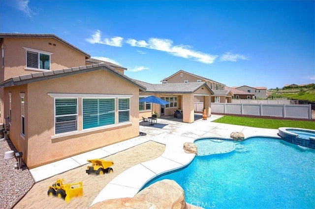 13471 Planet Ct, Riverside, CA 92503 - view of swimming pool featuring a patio and a pool with connected hot tub