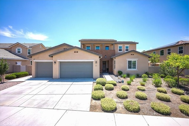 13471 Planet Ct, Riverside, CA 92503 - mediterranean / spanish house featuring an attached garage, driveway, and stucco siding