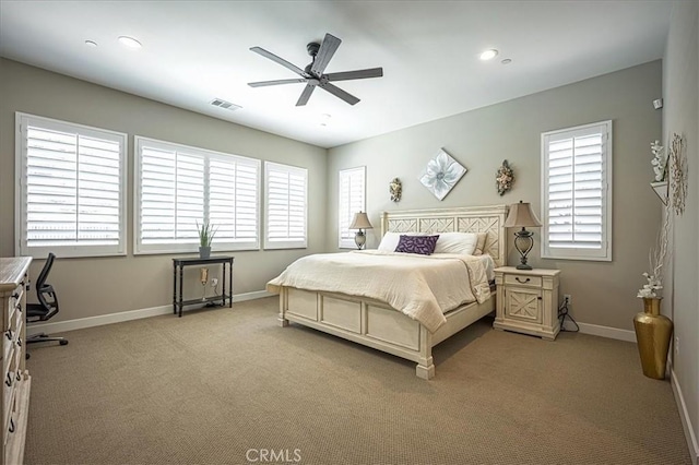13471 Planet Ct, Riverside, CA 92503 - bedroom featuring light colored carpet, multiple windows, a ceiling fan, and recessed lighting