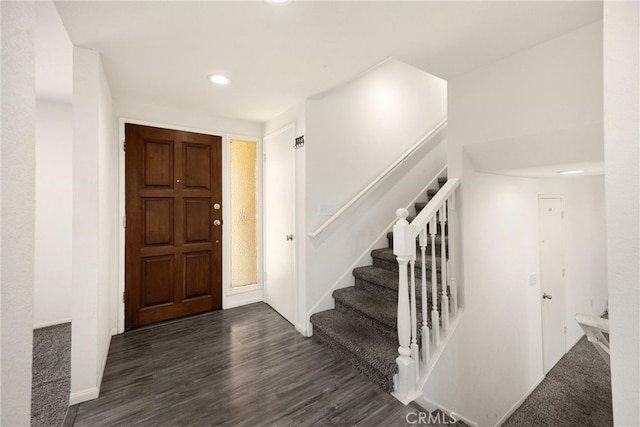 17342 Almelo Ln, Huntington Beach, CA 92649 - entryway with dark wood finished floors, stairs, and recessed lighting