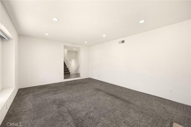 17342 Almelo Ln, Huntington Beach, CA 92649 - carpeted empty room with stairway and recessed lighting