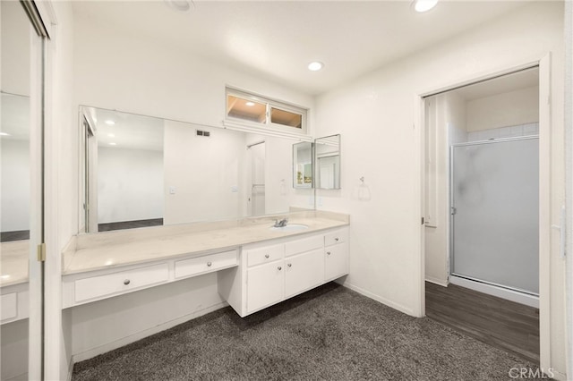 17342 Almelo Ln, Huntington Beach, CA 92649 - bathroom featuring vanity, a stall shower, recessed lighting, and carpet