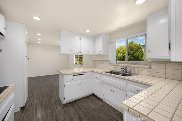 17342 Almelo Ln, Huntington Beach, CA 92649 - kitchen with a peninsula, decorative backsplash, white cabinets, and recessed lighting