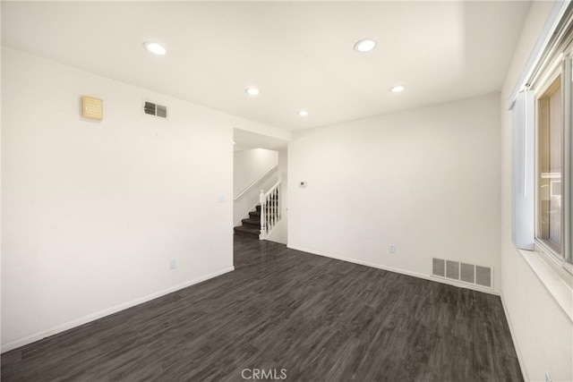 17342 Almelo Ln, Huntington Beach, CA 92649 - unfurnished room with dark wood-type flooring, recessed lighting, and stairs