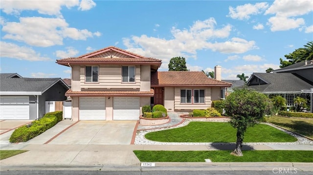 17342 Almelo Ln, Huntington Beach, CA 92649 - tri-level home with a tile roof, concrete driveway, a front lawn, stucco siding, and a garage