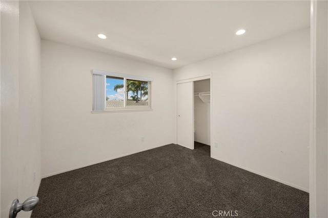 17342 Almelo Ln, Huntington Beach, CA 92649 - unfurnished bedroom with recessed lighting, dark carpet, and a closet