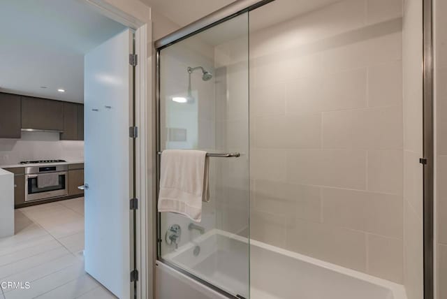 889 Francisco St Unit 802, Los Angeles, CA 90017 - full bath with combined bath / shower with glass door, vanity, tile patterned floors, and recessed lighting
