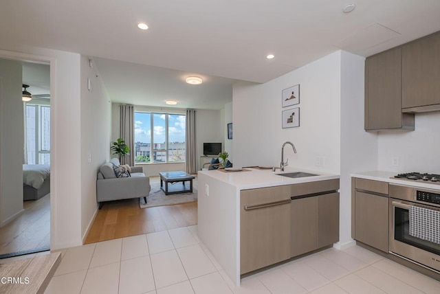 889 Francisco St Unit 802, Los Angeles, CA 90017 - kitchen with appliances with stainless steel finishes, open floor plan, plenty of natural light, light countertops, and recessed lighting