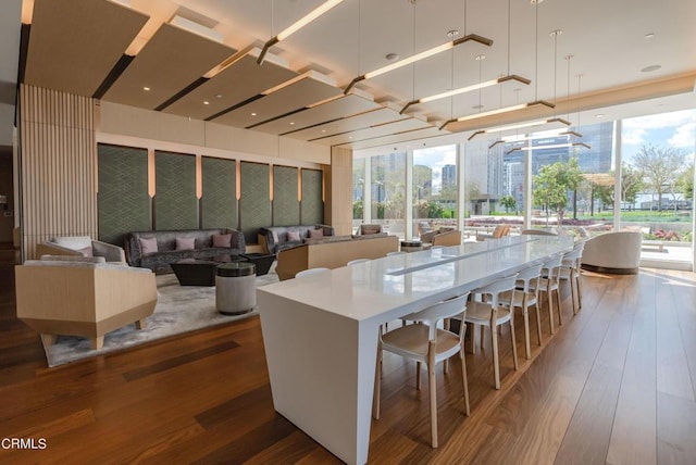 889 Francisco St Unit 802, Los Angeles, CA 90017 - kitchen featuring wood finished floors, a spacious island, and a breakfast bar