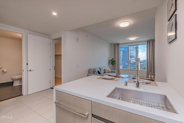 889 Francisco St Unit 802, Los Angeles, CA 90017 - kitchen featuring light countertops, open floor plan, and light tile patterned floors