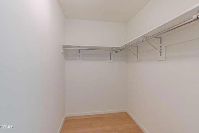 889 Francisco St Unit 802, Los Angeles, CA 90017 - walk in closet with light wood-type flooring