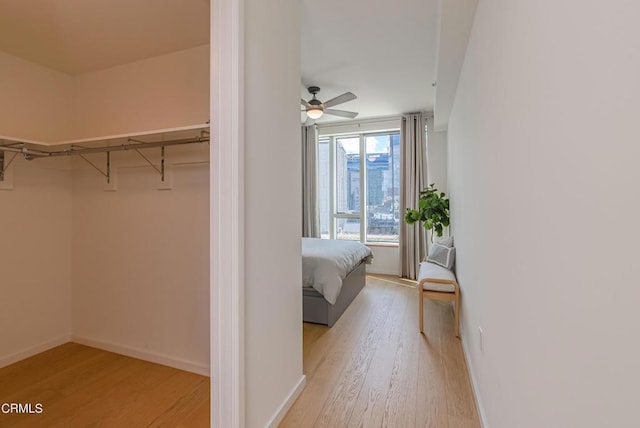 889 Francisco St Unit 802, Los Angeles, CA 90017 - walk in closet with wood finished floors and ceiling fan
