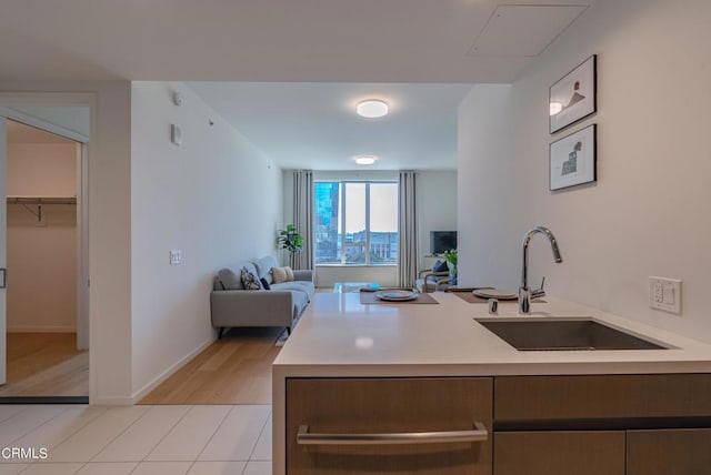 889 Francisco St Unit 802, Los Angeles, CA 90017 - kitchen with light countertops, open floor plan, and light wood finished floors