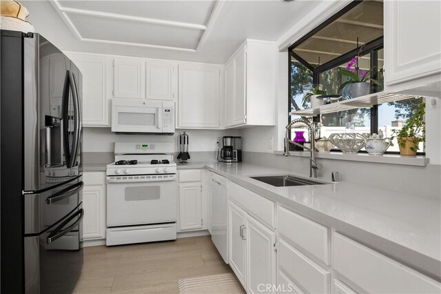 1365 Kroonen Dr, Corona, CA 92882 - kitchen featuring white appliances, light countertops, and white cabinets