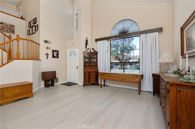 1365 Kroonen Dr, Corona, CA 92882 - entrance foyer featuring a high ceiling, light wood-style flooring, and stairs