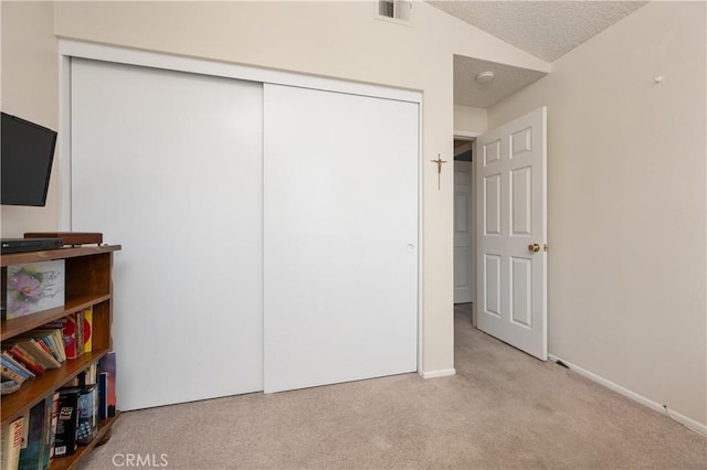 1365 Kroonen Dr, Corona, CA 92882 - carpeted bedroom with a closet, a textured ceiling, and vaulted ceiling