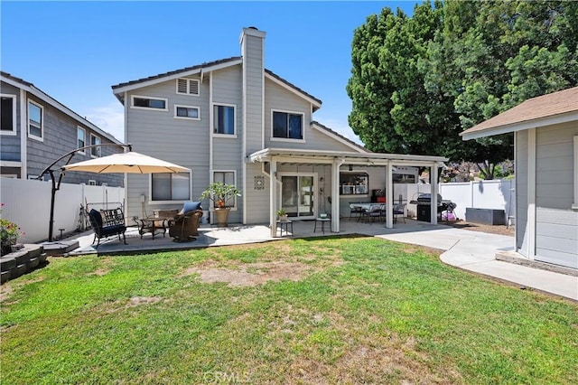 1365 Kroonen Dr, Corona, CA 92882 - back of property with a patio, a chimney, and outdoor lounge area