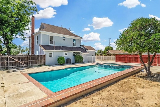 12887 Mount Vernon Ave, Grand Terrace, CA 92313 - view of pool featuring a patio area, a fenced backyard, and a pool with connected hot tub
