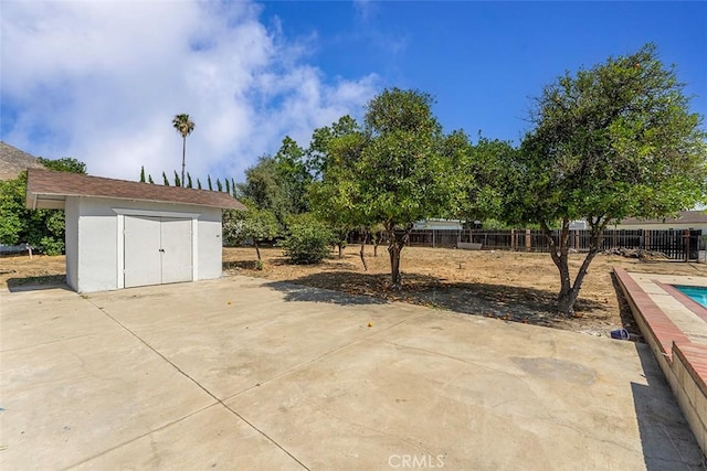 12887 Mount Vernon Ave, Grand Terrace, CA 92313 - view of patio / terrace featuring a storage shed