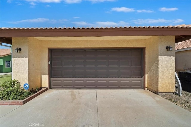 13969 Chervil Ct, Moreno Valley, CA 92553 - garage featuring concrete driveway