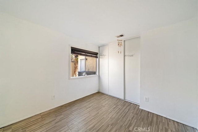13969 Chervil Ct, Moreno Valley, CA 92553 - spare room featuring wood finished floors and baseboards