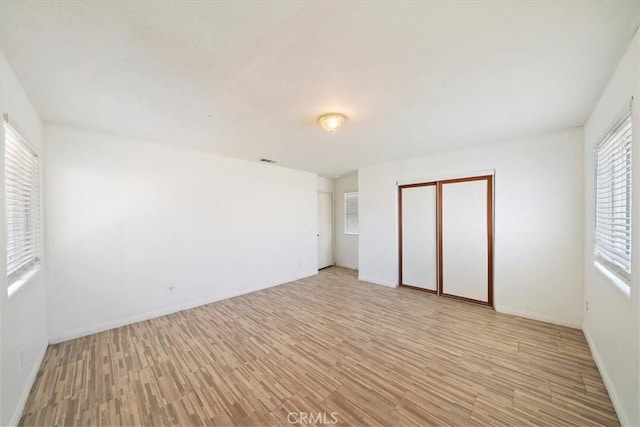 13969 Chervil Ct, Moreno Valley, CA 92553 - unfurnished bedroom featuring light wood-style floors and a closet