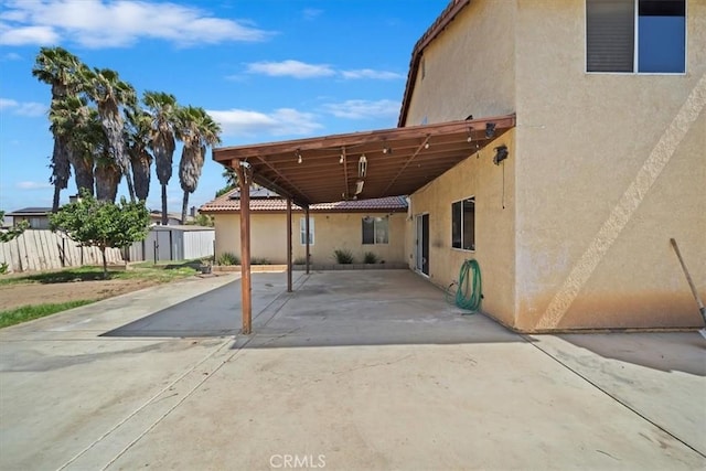 13969 Chervil Ct, Moreno Valley, CA 92553 - view of patio / terrace featuring a shed, a carport, and driveway
