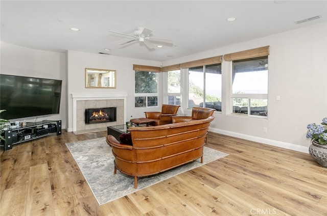 24736 Wooded Vis, West Hills, CA 91307 - living area featuring ceiling fan, a tiled fireplace, recessed lighting, and wood finished floors