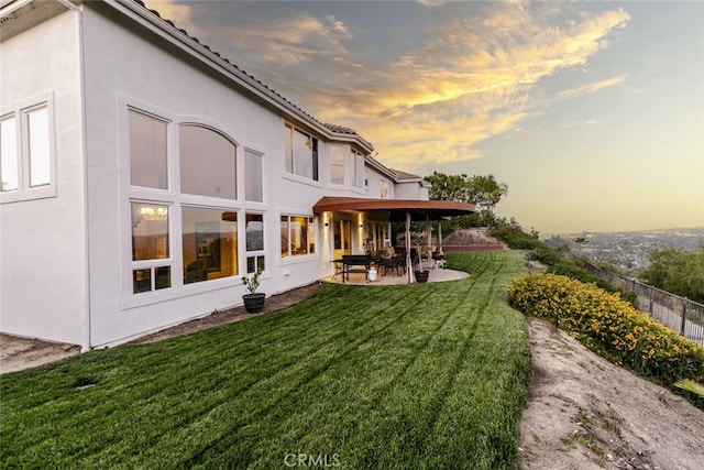 24736 Wooded Vis, West Hills, CA 91307 - back of house at dusk with a patio and stucco siding