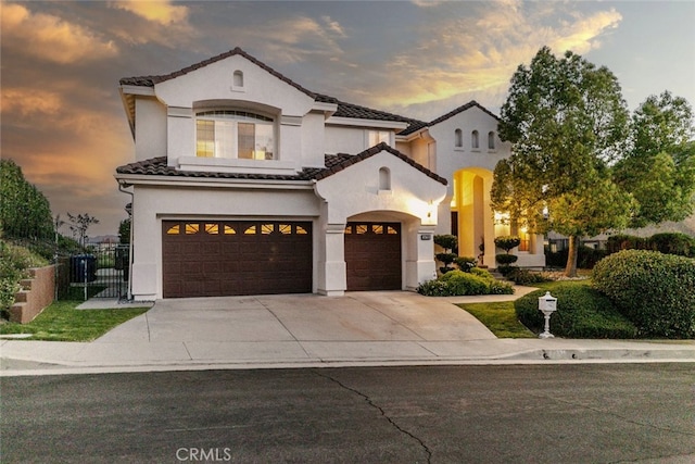 24736 Wooded Vis, West Hills, CA 91307 - view of front of home with stucco siding, driveway, a tile roof, and an attached garage