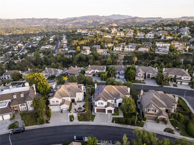 24736 Wooded Vis, West Hills, CA 91307 - aerial view of property's location with nearby suburban area and a mountain backdrop