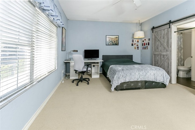 24736 Wooded Vis, West Hills, CA 91307 - bedroom with light carpet, a barn door, an office area, and a ceiling fan