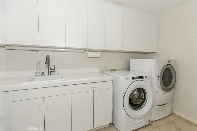 24736 Wooded Vis, West Hills, CA 91307 - laundry room with cabinet space, washing machine and dryer, and light tile patterned flooring