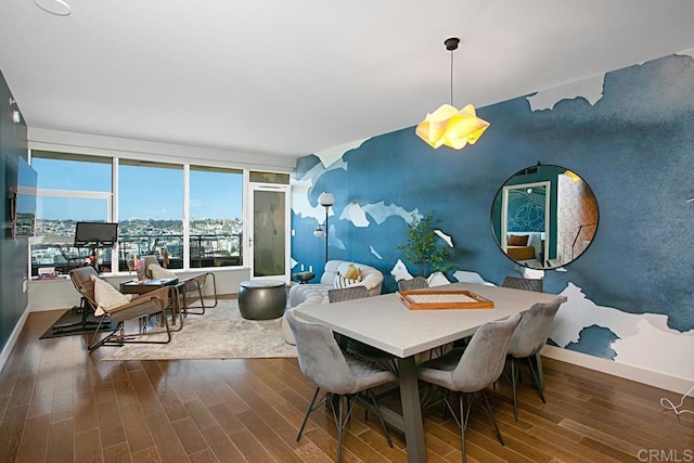 1325 Pacific Hwy Unit 2106, San Diego, CA 92101 - dining space featuring an accent wall and wood finished floors