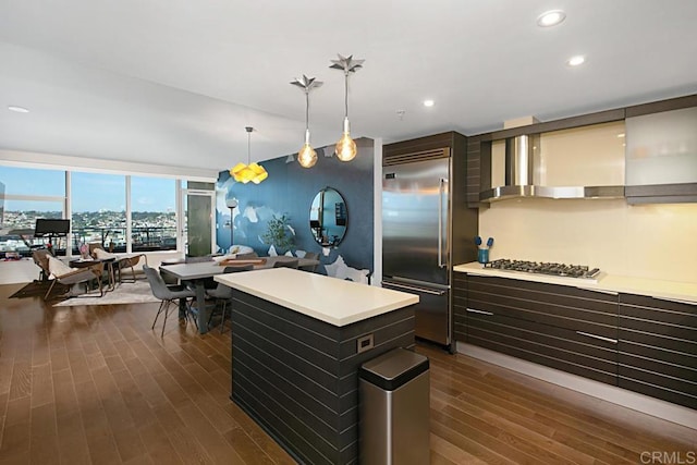 1325 Pacific Hwy Unit 2106, San Diego, CA 92101 - kitchen with stainless steel appliances, light countertops, dark wood-style floors, decorative light fixtures, and open floor plan