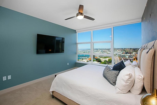 1325 Pacific Hwy Unit 2106, San Diego, CA 92101 - bedroom featuring a wall of windows, carpet floors, and ceiling fan