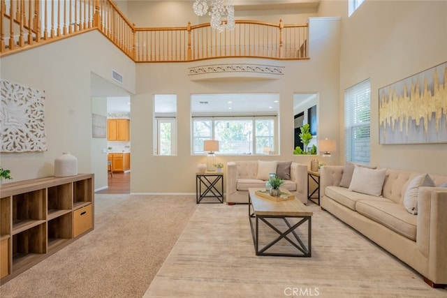 4892 Borders St, Simi Valley, CA 93063 - carpeted living room featuring a high ceiling and a chandelier