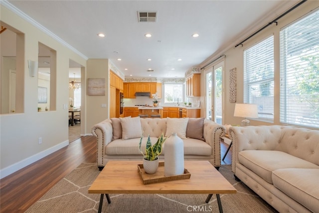4892 Borders St, Simi Valley, CA 93063 - living room featuring recessed lighting, dark wood-style floors, and ornamental molding