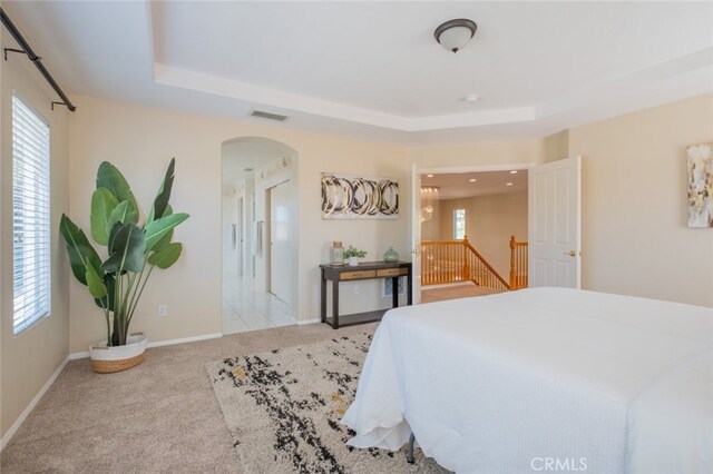 4892 Borders St, Simi Valley, CA 93063 - bedroom with arched walkways, carpet, a raised ceiling, and multiple windows