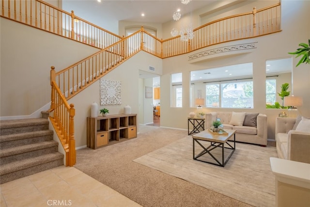 4892 Borders St, Simi Valley, CA 93063 - carpeted living room featuring a high ceiling, stairs, a chandelier, and recessed lighting