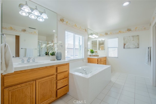 4892 Borders St, Simi Valley, CA 93063 - bathroom featuring a garden tub, two vanities, a stall shower, and tile patterned floors