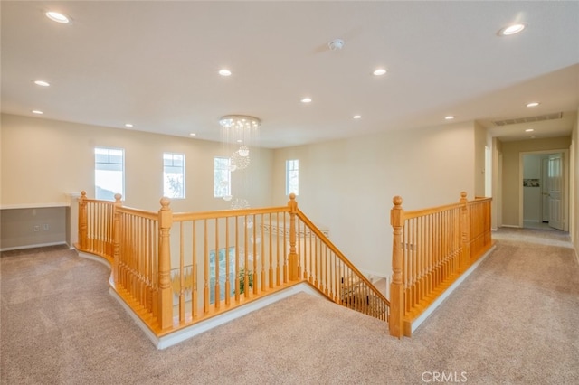 4892 Borders St, Simi Valley, CA 93063 - hallway with an upstairs landing, carpet floors, recessed lighting, and a chandelier
