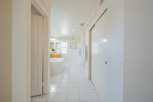 4892 Borders St, Simi Valley, CA 93063 - corridor with light tile patterned floors and recessed lighting