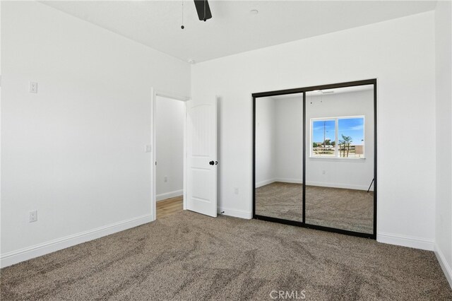 15323 Turquoise Rd, Apple Valley, CA 92307 - unfurnished bedroom with carpet, a closet, and a ceiling fan