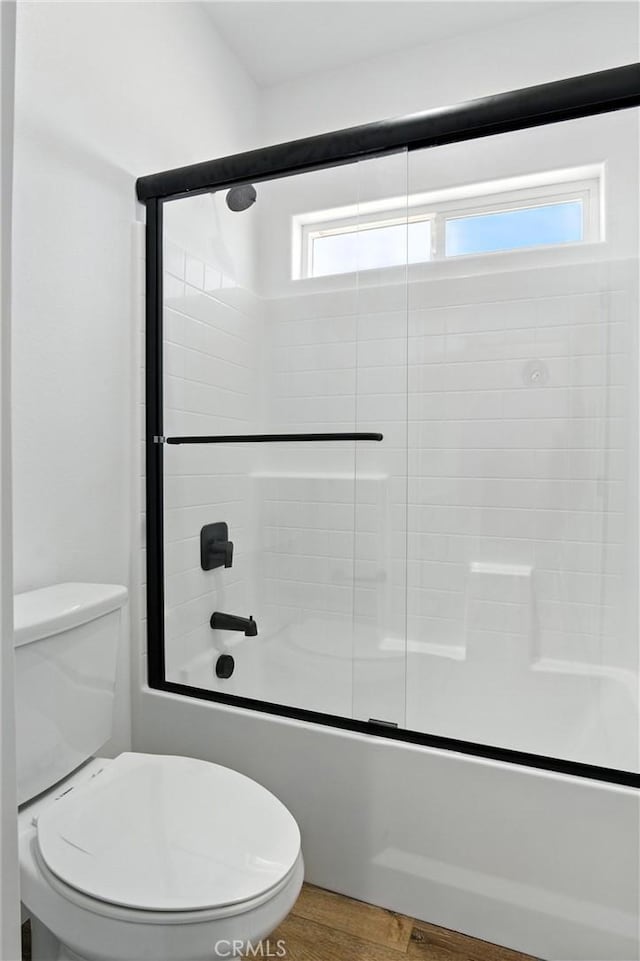 15323 Turquoise Rd, Apple Valley, CA 92307 - bathroom featuring enclosed tub / shower combo and wood finished floors
