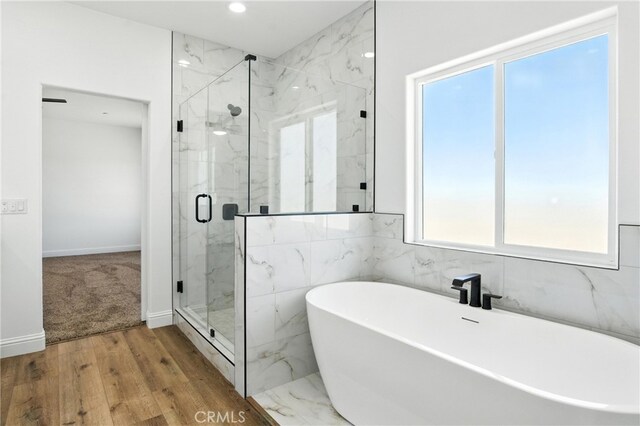 15323 Turquoise Rd, Apple Valley, CA 92307 - full bathroom featuring a marble finish shower, a freestanding bath, wood finished floors, and recessed lighting